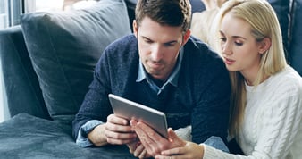 A wife empathizing with her husband over a missed promotion